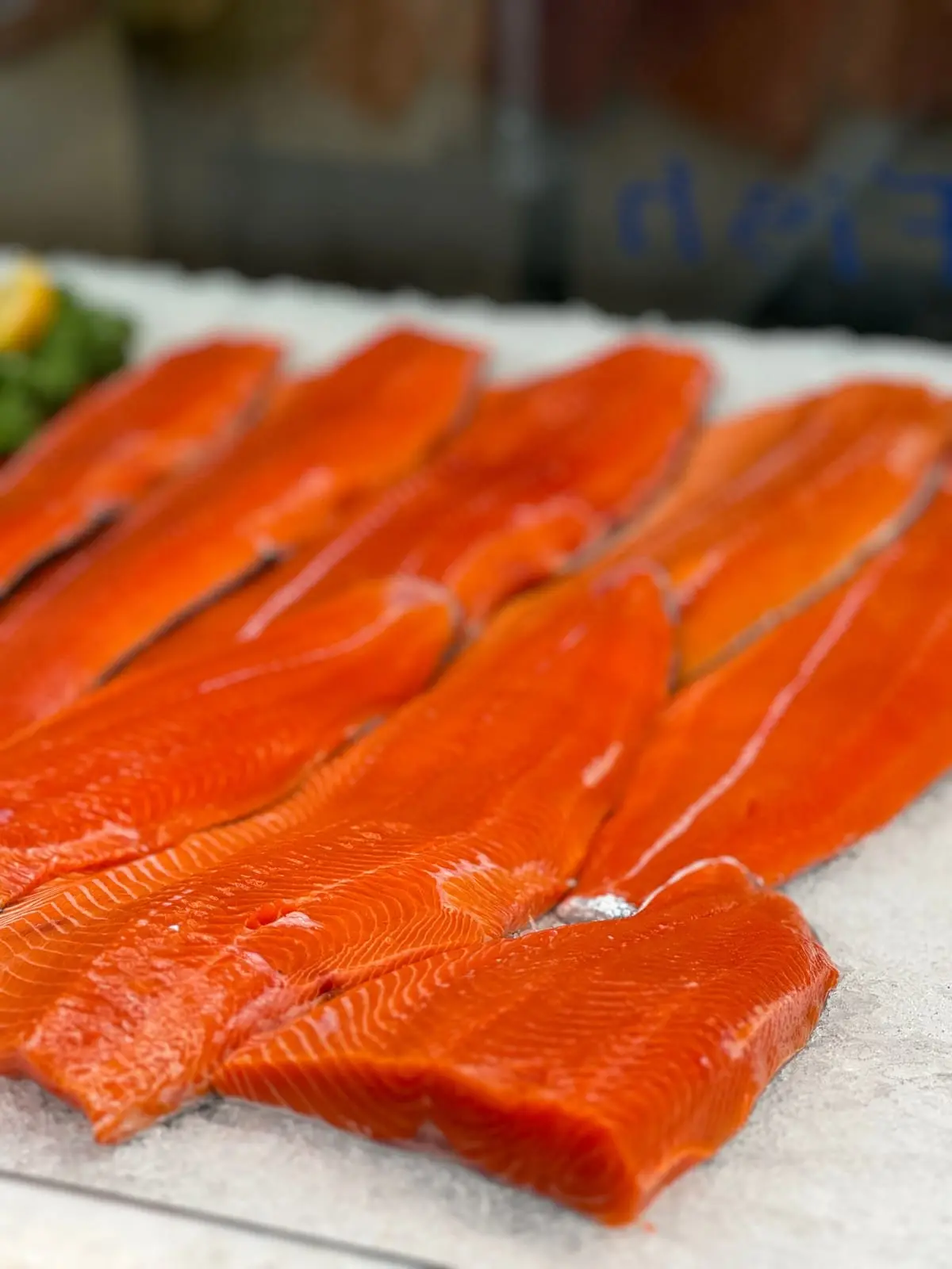 Fresh-cut BC sockeye salmon fillets laid out on paper