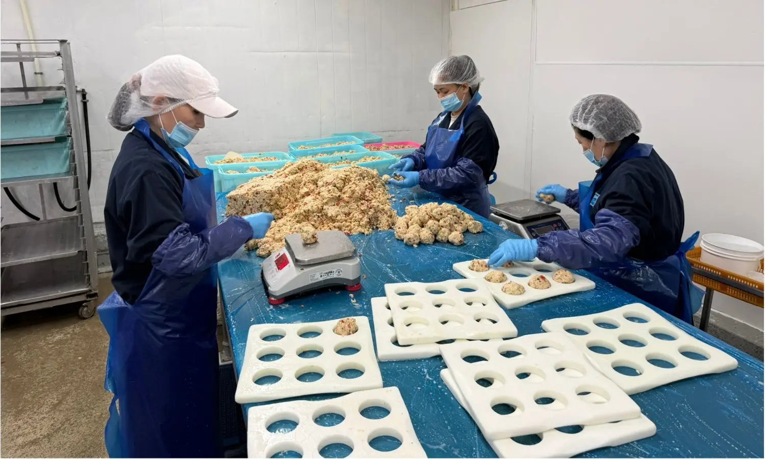 Team weighing and forming crab cakes in the ready-to-eat production room at 7 Seas' Richmond, BC plant