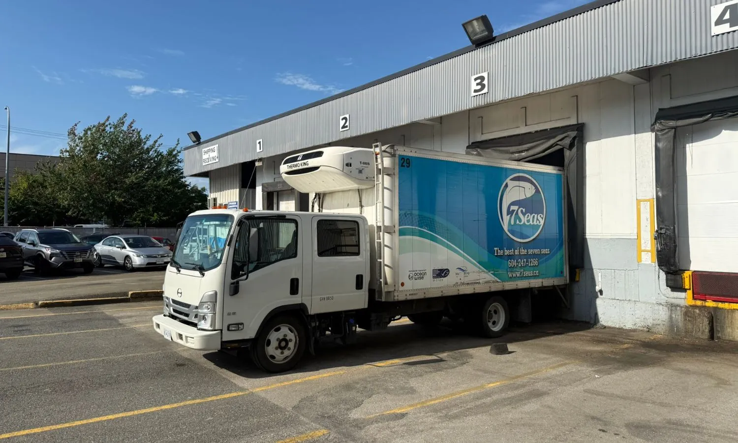 A 7 Seas refrigerated delivery truck loading up in bay 3 for the next delivery run