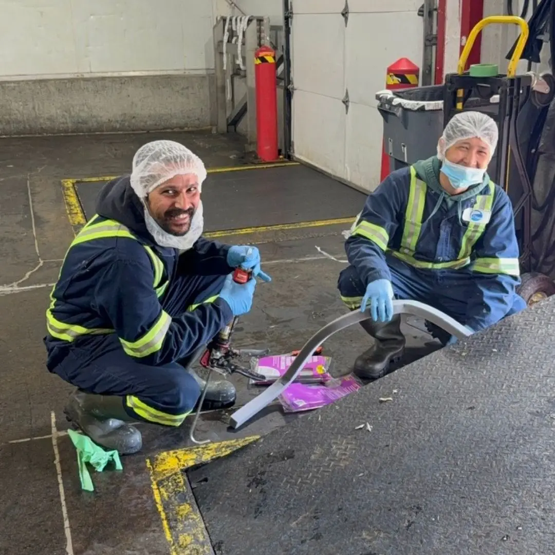 The maintenance team repairing the loading bay truck ramp