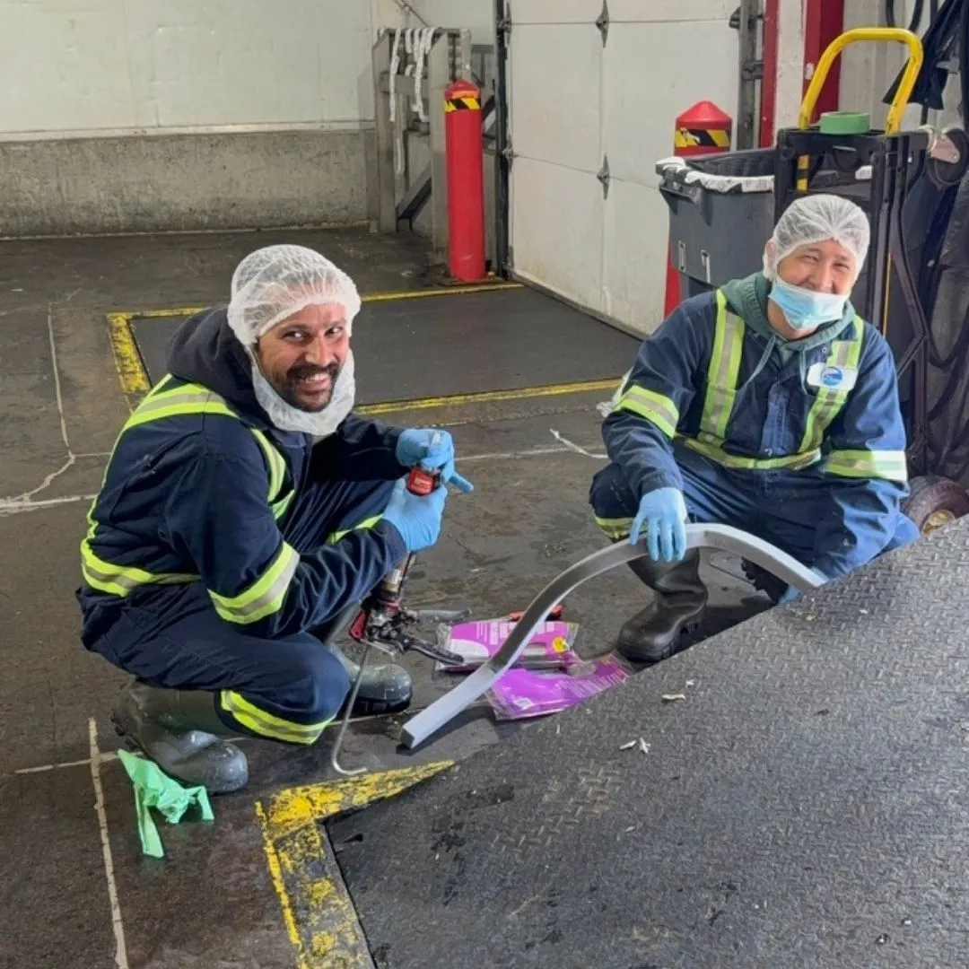 The maintenance team repairing the loading bay truck ramp