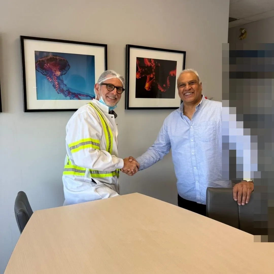 Two members of the management team posing for the camera