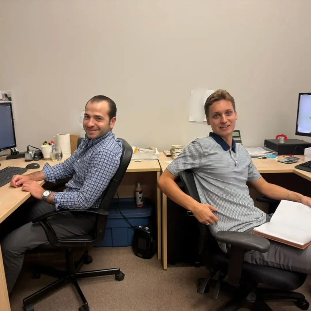 Two members of the purchasing team smiling for the camera