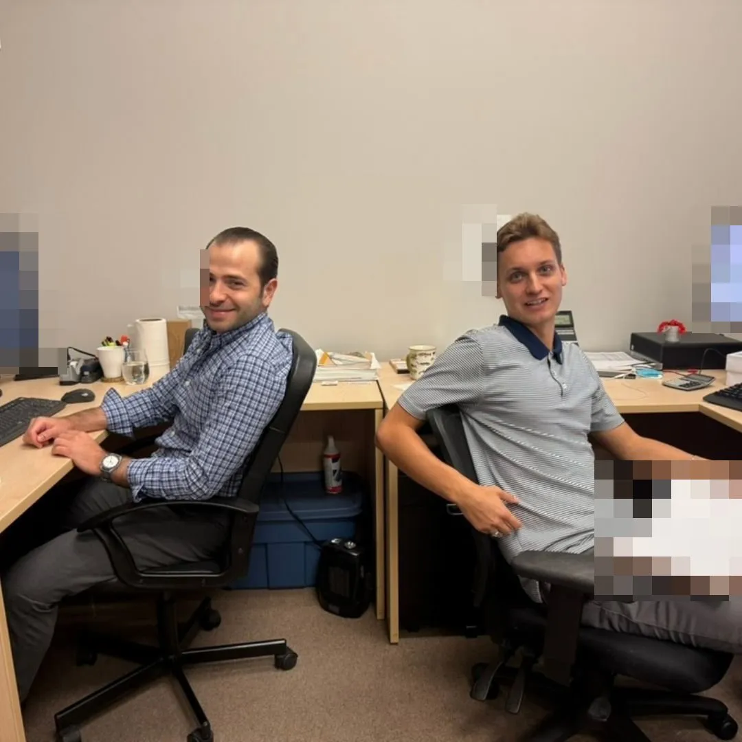 Two members of the purchasing team smiling for the camera
