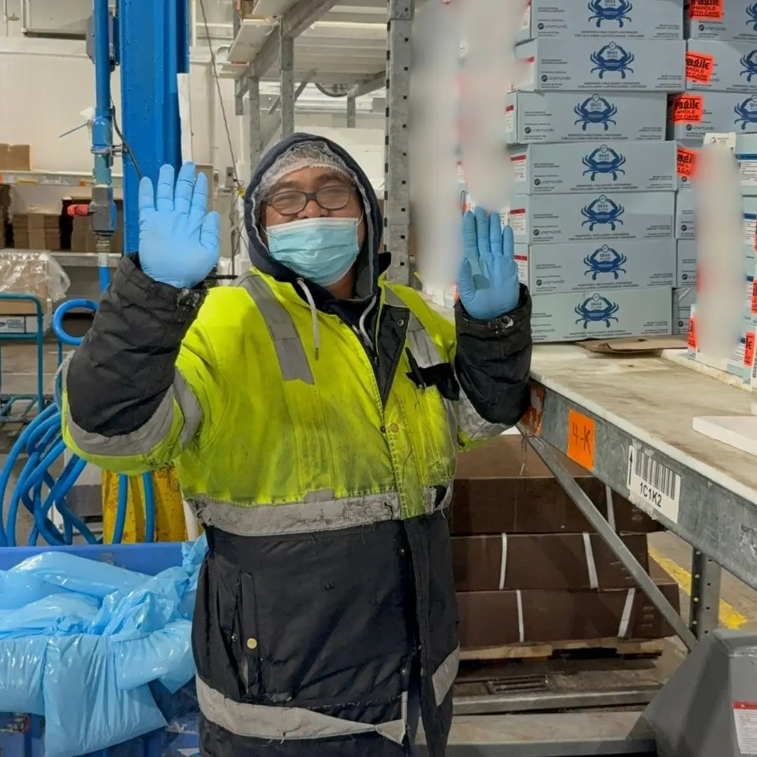 A member of the receiving team smiling for the camera