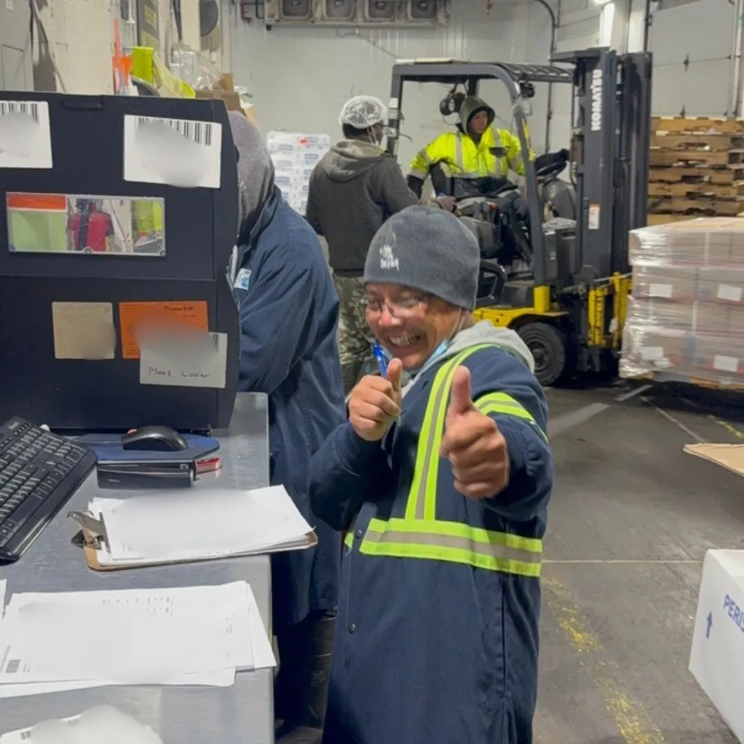 A receiver giving two thumbs up at the receiving desk