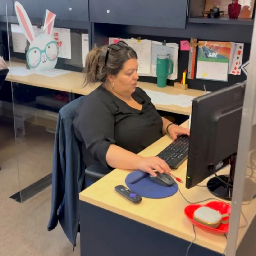 A member of the sales team at work at a desk