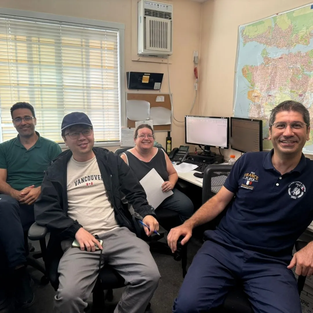The 7 Seas shipping and logistics team of four smiling for the camera