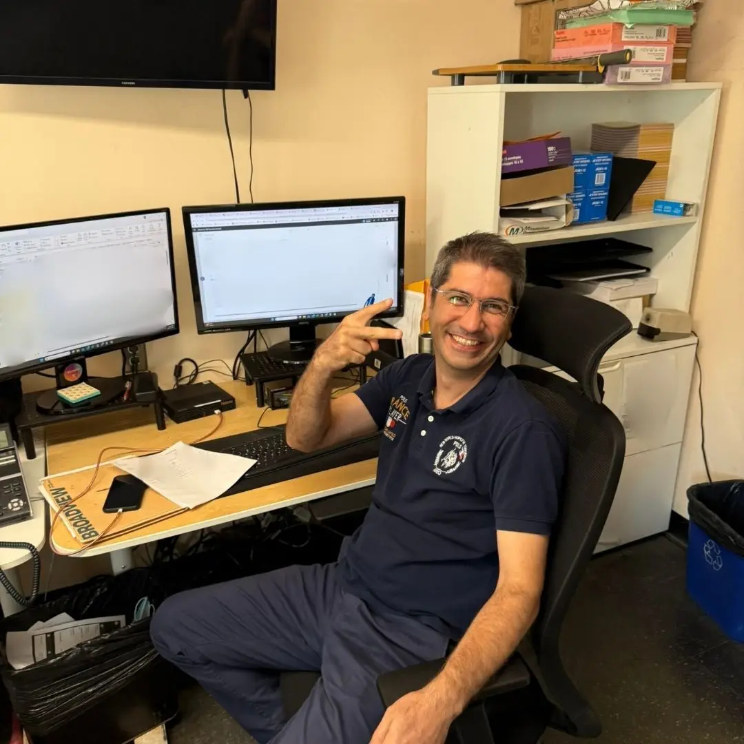 Another member of the shipping team smiling for the camera