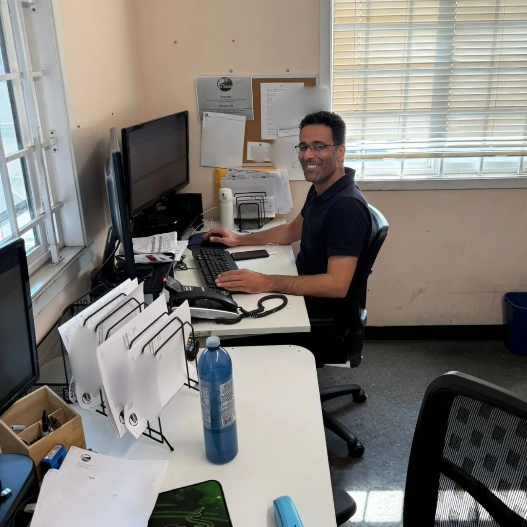 A member of the shipping team smiling for the camera