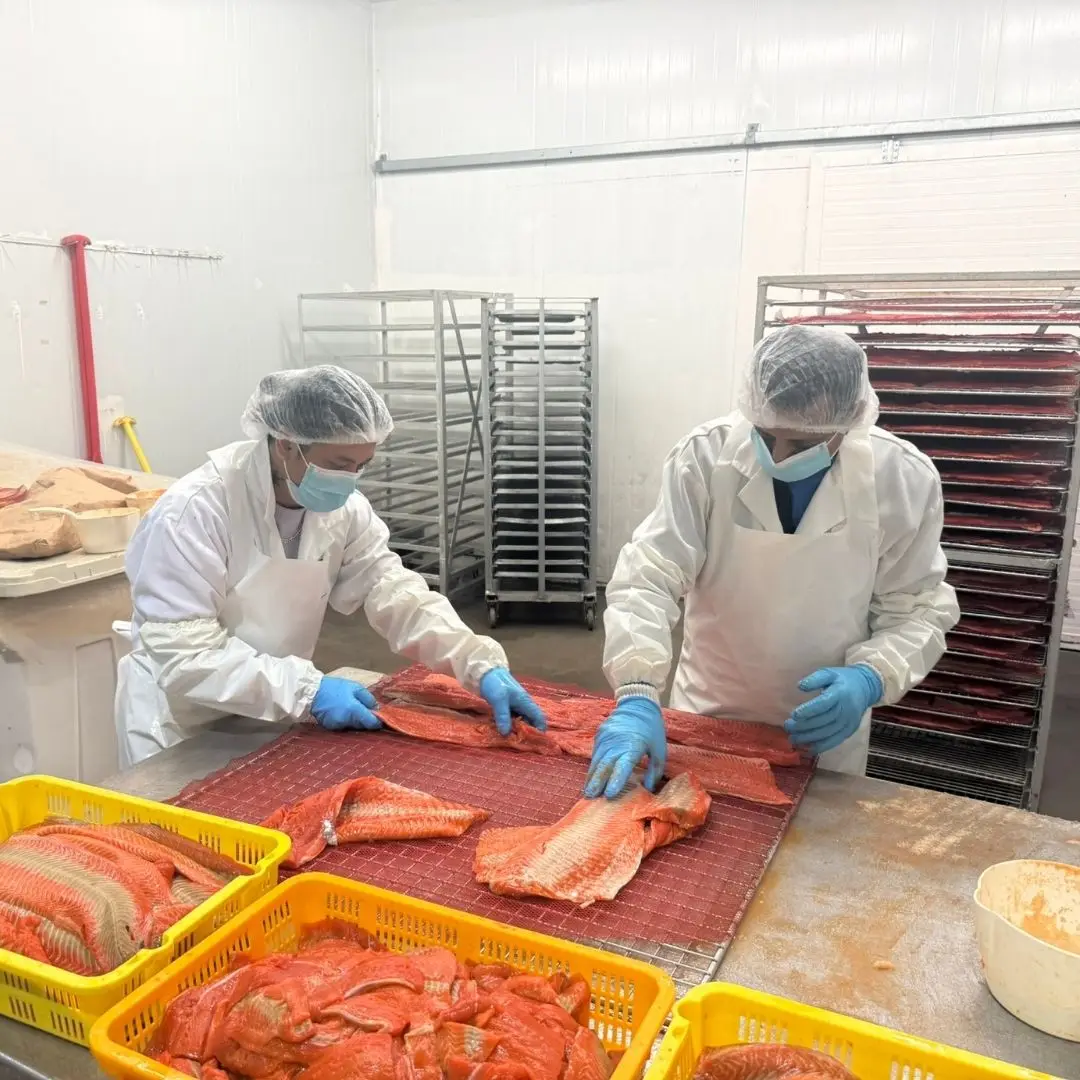 Team racking and spicing sockeye salmon before it goes into the smoker at 7 Seas' Richmond, BC smokehouse