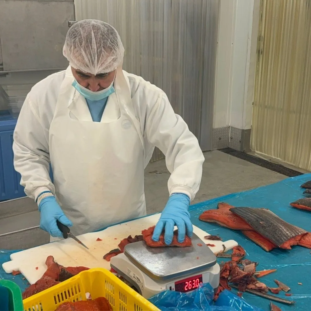 Weighing portions of smoked sockeye salmon
