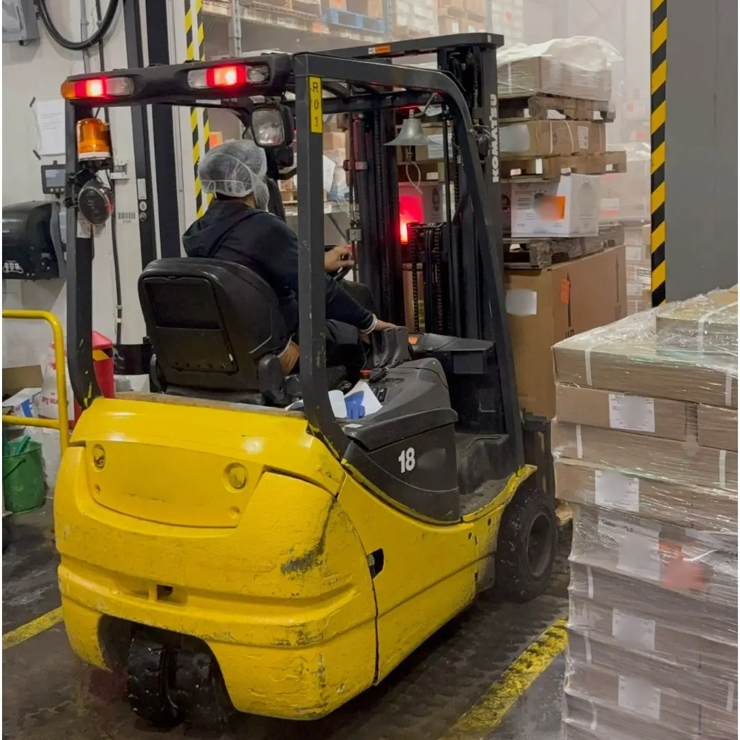 Forklift loading a wrapped pallet into the freezer at 7 Seas' Richmond, BC warehouse